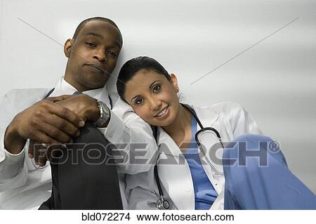 Picture - Tired doctors relaxing. Fotosearch