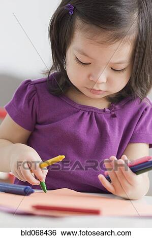 Toddler girl coloring with crayons View Large Photo Image Stock Photograph - Toddler girl coloring with crayons. Fotosearch