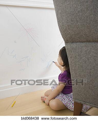 Toddler girl drawing on wall with crayons View Large Photo Image Stock Photo - Toddler girl drawing on wall with crayons. Fotosearch