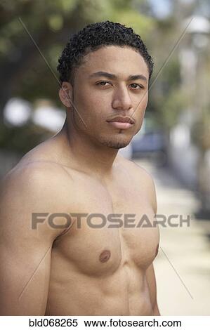 Young mixed race man with bare chest View Large Photo Image Stock Photography - Young mixed race man with bare chest. Fotosearch
