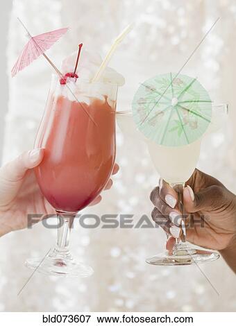 African and Caucasian woman drinking frozen cocktails View Large Photo Image Stock Photo - African and Caucasian woman drinking frozen cocktails. Fotosearch