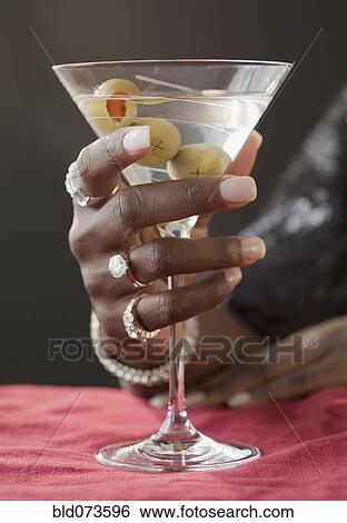 Stock Photograph - African woman drinking martini. Fotosearch