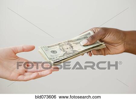 African woman handing over stack of 20 dollar bills View Large Photo Image Stock Photograph - African woman handing over stack of 20 dollar bills. Fotosearch
