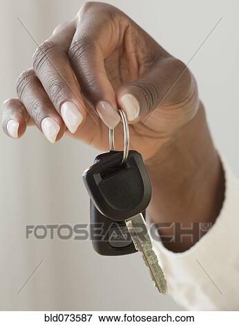 African woman holding car keys View Large Photo Image Stock Photo - African woman holding car keys. Fotosearch