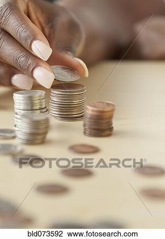 African woman staking quarters View Large Photo Image Stock Image - African woman staking quarters. Fotosearch
