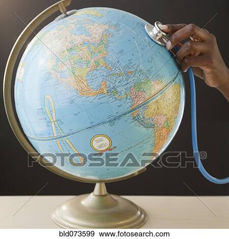 African woman using stethoscope on globe View Large Photo Image Stock Photo - African woman using stethoscope on globe. Fotosearch