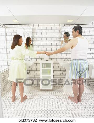 Asian husband and wife in bathroom together View Large Photo Image Stock Image - Asian husband and wife in bathroom together. Fotosearch