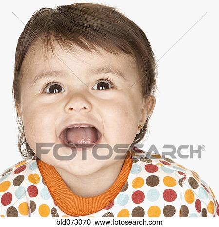 Close up of laughing hispanic baby girl View Large Photo Image Stock Image - Close up of laughing hispanic baby girl. Fotosearch