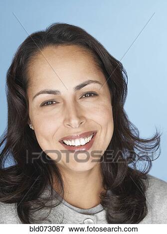 Stock Photo - Close up of smiling Hispanic woman. Fotosearch