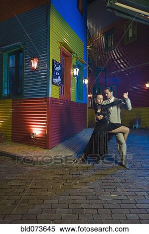 Stock Photography - Hispanic couple performing tango on city street. Fotosearch