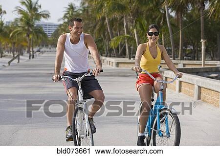 Hispanic couple riding bicycles View Large Photo Image Stock Image - Hispanic couple riding bicycles. Fotosearch
