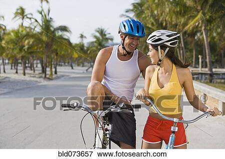 Hispanic couple riding bicycles View Large Photo Image Stock Photo - Hispanic couple riding bicycles. Fotosearch