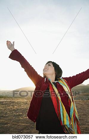 Hispanic woman enjoying the outdoors View Large Photo Image Stock Photo - Hispanic woman enjoying the outdoors. Fotosearch