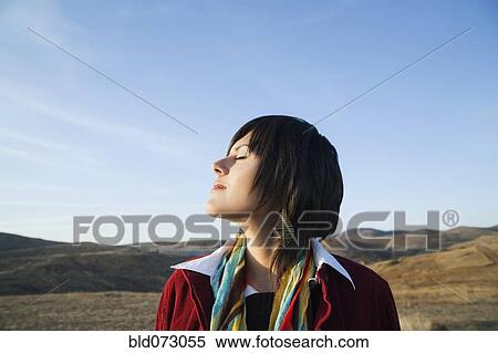 Stock Photography - Hispanic woman enjoying the outdoors. Fotosearch