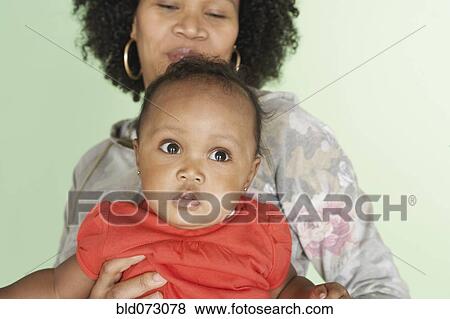 Mixed race mother and baby daughter View Large Photo Image Stock Photo - Mixed race mother and baby daughter. Fotosearch