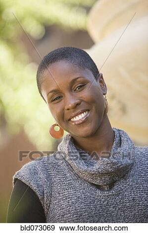Smiling African woman outdoors View Large Photo Image Stock Photo - Smiling African woman outdoors. Fotosearch