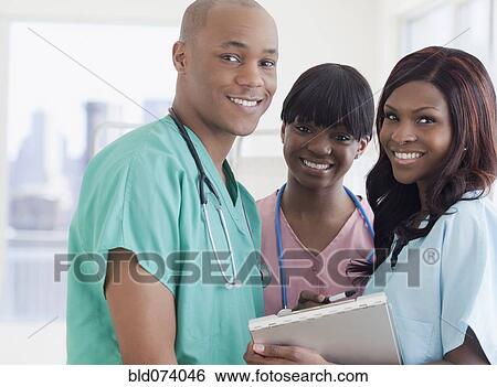 Stock Photograph - African doctor and nurses in hospital. Fotosearch