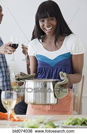 African woman preparing dinner View Large Photo Image Stock Photo - African woman preparing dinner. Fotosearch