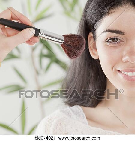 Hispanic woman applying blush View Large Photo Image Stock Image - Hispanic woman applying blush. Fotosearch