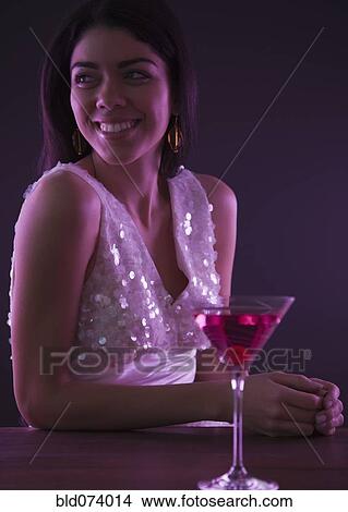 Hispanic woman drinking cocktails View Large Photo Image Picture - Hispanic woman drinking cocktails. Fotosearch