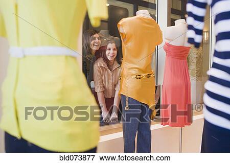 Middle Eastern mother and daughter window shopping View Large Photo Image Stock Photo - Middle Eastern mother and daughter window shopping. Fotosearch