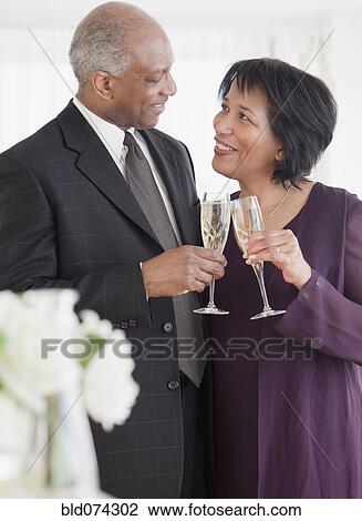 African couple drinking champagne View Large Photo Image Stock Image - African couple drinking champagne. Fotosearch