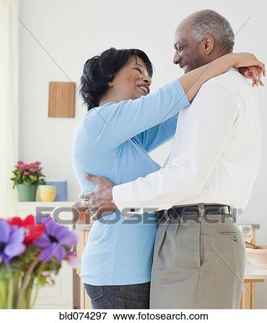 Stock Photo - African couple hugging. Fotosearch