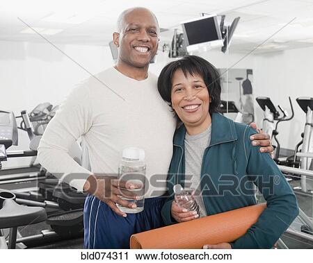 African couple standing in health club View Large Photo Image Stock Image - African couple standing in health club. Fotosearch
