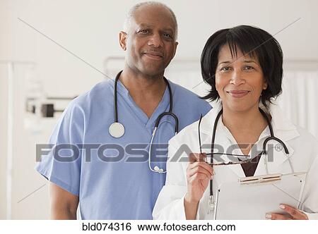Stock Photograph - African doctor and surgeon in hospital. Fotosearch