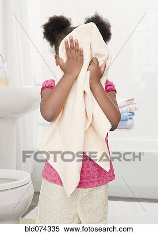 African girl drying face with towel View Large Photo Image Stock Photography - African girl drying face with towel. Fotosearch