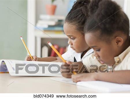 African girls doing homework View Large Photo Image Stock Photo - African girls doing homework. Fotosearch