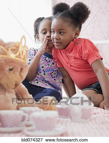 African girls telling secrets View Large Photo Image Stock Photo - African girls telling secrets. Fotosearch