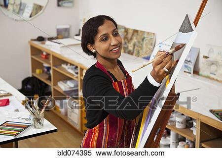 Stock Photography - Indian woman painting. Fotosearch