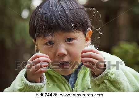 Korean boy holding sheet of ice View Large Photo Image Stock Photograph - Korean boy holding sheet of ice. Fotosearch