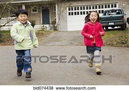 Stock Photo - Korean children running in street. Fotosearch