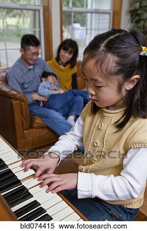 Korean girl playing piano View Large Photo Image Stock Photography - Korean girl playing piano. Fotosearch