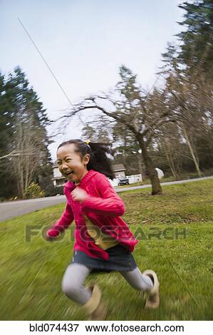 Korean girl running outdoors View Large Photo Image Stock Photo - Korean girl running outdoors. Fotosearch