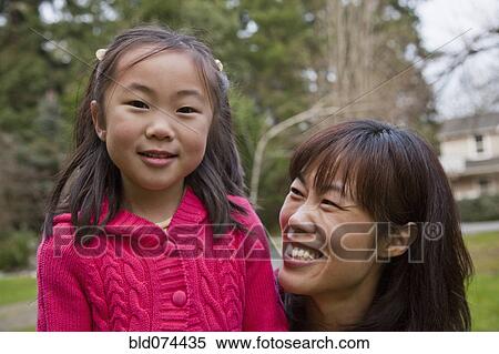 Stock Photography - Korean mother with daughter. Fotosearch