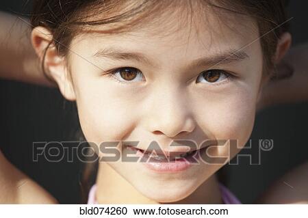 Mixed race girl smiling View Large Photo Image Stock Image - Mixed race girl smiling. Fotosearch