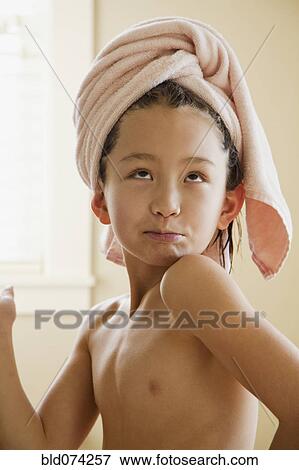 Mixed race girl with towel on head View Large Photo Image Stock Photo - Mixed race girl with towel on head. Fotosearch