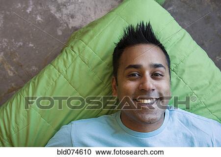 Stock Image - Smiling mixed race man. Fotosearch