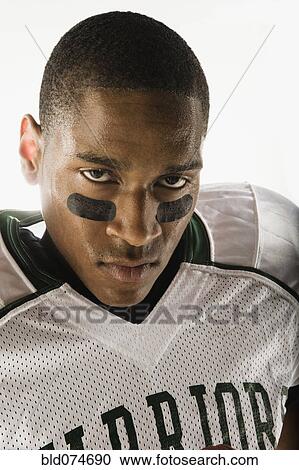 African football player with face paint under eyes View Large Photo Image Stock Image - African football player with face paint under eyes. Fotosearch