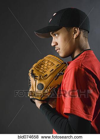 Mixed race baseball player looking serious View Large Photo Image Stock Photo - Mixed race baseball player looking serious. Fotosearch