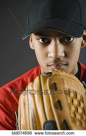 Mixed race baseball player looking serious View Large Photo Image Stock Photograph - Mixed race baseball player looking serious. Fotosearch