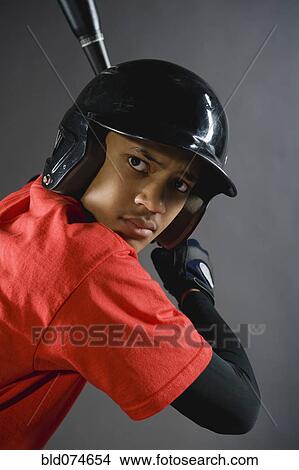 Mixed race baseball player ready to bat View Large Photo Image Picture - Mixed race baseball player ready to bat. Fotosearch