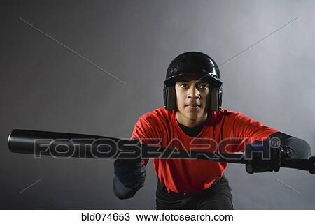 Mixed race baseball player ready to bunt with baseball bat View Large Photo Image Stock Image - Mixed race baseball player ready to bunt with baseball bat. Fotosearch