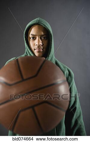 Mixed race boy holding basketball View Large Photo Image Picture - Mixed race boy holding basketball. Fotosearch