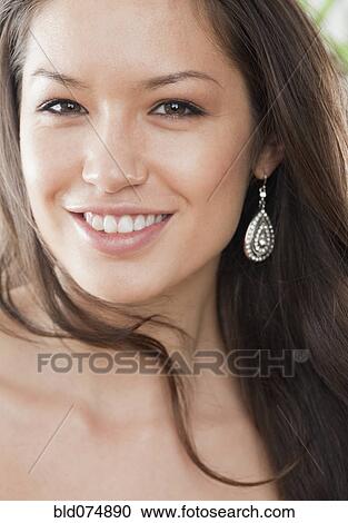 Stock Image - Mixed race woman smiling. Fotosearch