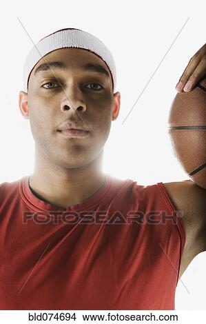 Picture - Serious African basketball player. Fotosearch