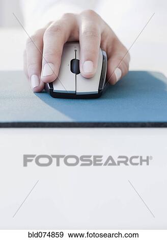 Woman clicking on computer mouse View Large Photo Image Stock Photo - Woman clicking on computer mouse. Fotosearch
